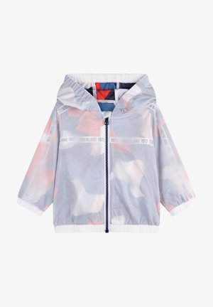 Giacca con cappuccio in mesh grigio chiaro con zip frontale, polsini e orlo elasticizzati e delicati accenti in colori pastello sul tessuto sottostante.