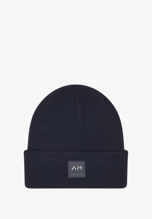 Berretto a maglia blu navy con risvolto, dotato di una patch in pelle quadrata con logo impresso. Tessuto morbido, vestibilità aderente.