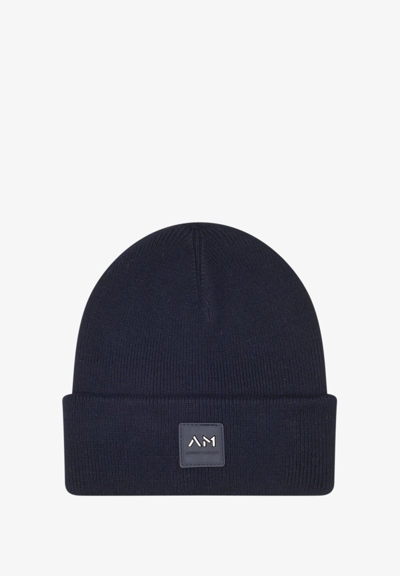 Berretto a maglia blu navy con risvolto, dotato di una patch in pelle quadrata con logo impresso. Tessuto morbido, vestibilità aderente.