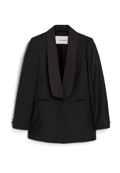 Black blazer with a satin shawl collar, structured design, two front pockets, and buttoned cuffs. Fabric appears smooth with a tailored fit.