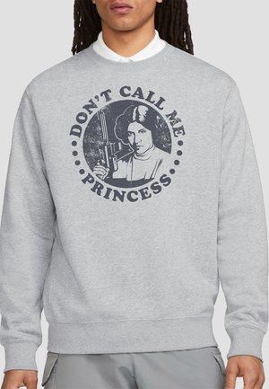 Gray sweatshirt featuring a distressed graphic of a character holding a blaster, with the text "DON'T CALL ME PRINCESS" in bold lettering.