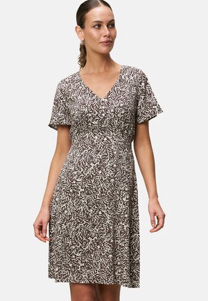 Brown and white patterned dress with a V-neckline, short sleeves, and a fitted waist. Soft fabric with a flowing skirt design.