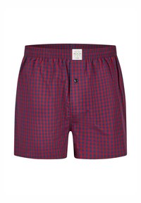 Rood- en marineblauw geruite boxers met een elastische tailleband, een enkele knoopsluiting en een label met maat- en merkinformatie.