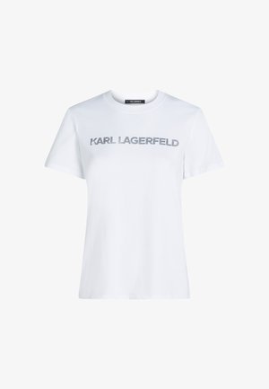 Biała bawełniana koszulka z krótkim rękawem, z napisem "KARL LAGERFELD" w metaliczno-srebrnym kolorze na wysokości klatki piersiowej. Klasyczny krój z okrągłym dekoltem.