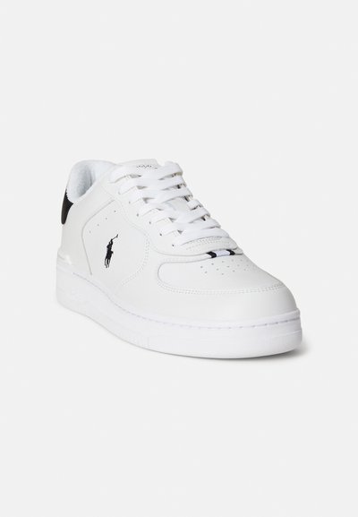 White leather sneakers with a perforated toe box, flat laces, and a black heel accent featuring a small logo on the side.