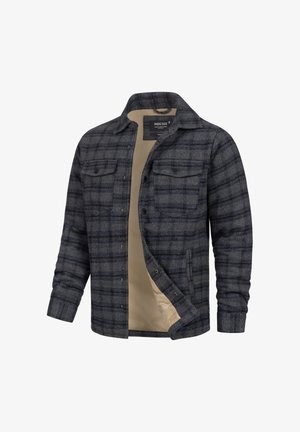 Chemise en flanelle à carreaux gris avec un intérieur beige, dotée de deux poches poitrine et d'un devant boutonné, fabriquée dans un tissu doux.