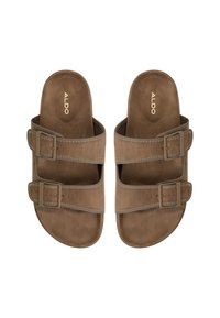 Brown suede sandals with two wide straps featuring rectangular buckles. Designed with a flat sole and contrasting stitching details.
