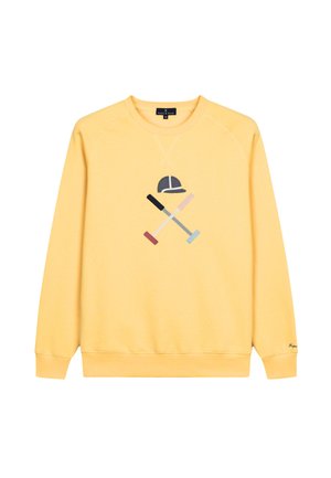 Sudadera amarilla con un cuello redondo, que presenta un gráfico de una gorra y mazos cruzados en rosa, azul, negro y gris. Textura de tela suave.