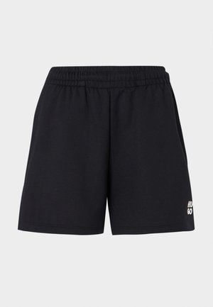 Sorte shorts med elastisk talje, lavet af blødt stof. Har et lille hvidt "HUGO" logo på den nedre venstre side.