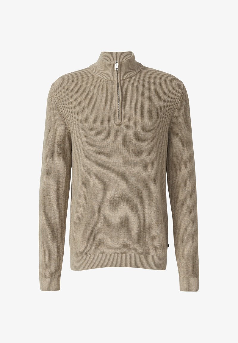 Švarkelis, megztas iš šviesiai smėlinės spalvos siūlų, turintis aukštą apykaklę ir pusę užtrauktuko. Jame yra tekstūruota medžiaga bei raukšlėti rankogaliai ir apačia, suteikiantys prigludusį vaizdą.