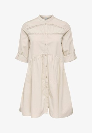 Beige button-up dress made of soft fabric, featuring a cinched waist, three-quarter sleeves, and decorative stitching on the bodice.