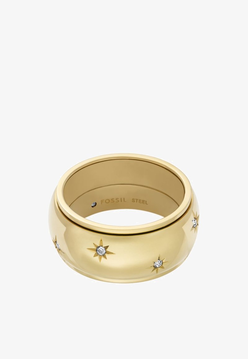 Gold-colored stainless steel ring with a smooth surface, featuring star patterns and small clear gemstones for accents. Inner engraving: "FOSSIL STEEL."