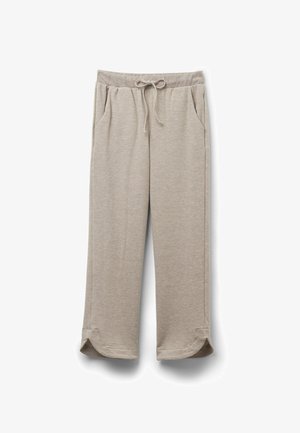 Lichtbeige sweatpants gemaakt van zachte stof, met een elastische tailleband met trekkoord, zijzakken en afgeronde zoom.