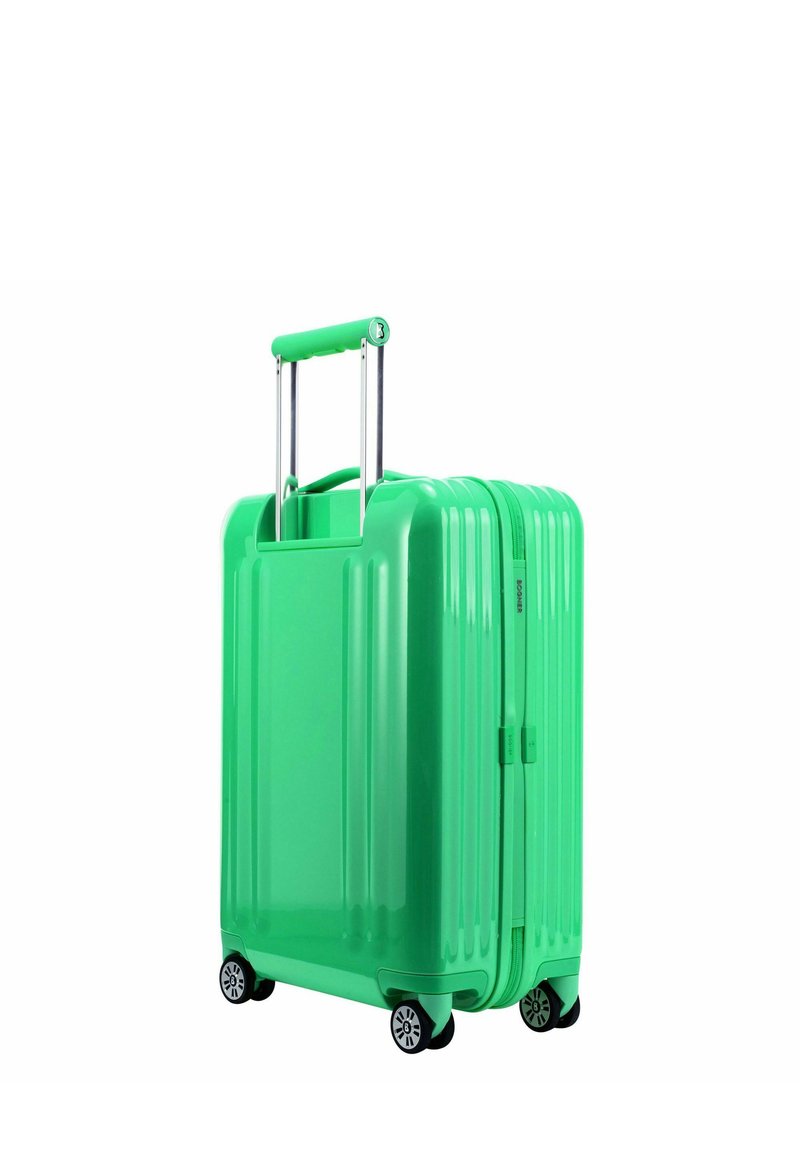 Grüner Hartschalenkoffer mit vertikaler Rippstrukturoberfläche, ausziehbarem Griff, doppeltem Reißverschluss und vier schwarzen Rädern für Mobilität.