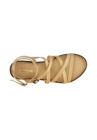 Sandal con cinturini sottili e neri, suola robusta e fibbia laterale per la chiusura. Fodera interna morbida visibile.
