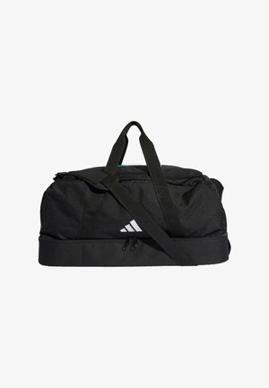 Czarna sportowa torba Adidas z podwójnymi uchwytami, regulowanym paskiem na ramię i dolną komorą zamykaną na zamek na białym tle.