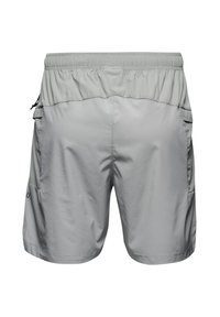 Grå idrottsshorts med elastisk midja, sidofickor och en mjuk, lätt material. Har en texturerad övre del.