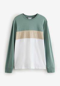 Katoenen T-shirt met lange mouwen, voorzien van groene mouwen, een beige horizontale streep en een witte onderkant. Subtiele logo geborduurd op de borst.