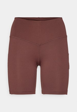 Dark brown, high-waisted bike shorts made from stretchy material, featuring a smooth texture and a fitted design with side pockets.