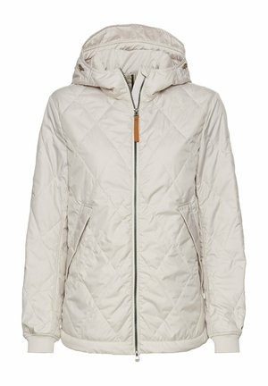 Veste beige matelassée avec capuche, fermeture éclair, deux poches latérales et poignets côtelés. Présente un accent en cuir beige sur la fermeture éclair.