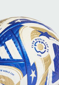 FIFA Club World Cup soccer ball featuring blue, gold, and white panels with a textured surface and logo details. Star and circular patterns present.