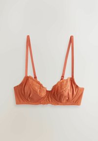 Bronzas-oranžs krūšturis ar mežģīņu detaļām augšpussē, ar satīna apdari, regulējamām siksnām un strukturētu formu.