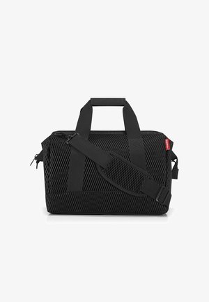 Black duffel bag made of mesh material, featuring two handles, a detachable adjustable strap, and a zip closure. Accented with a logo tag.