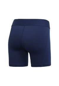 Námornícky modré športové šortky so širokým elastickým pásom, hladkou textúrou a priliehavým strihom, zobrazené zo zadného pohľadu s detailami na leme.