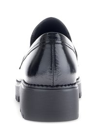 Black patent leather shoe with a smooth finish, rounded toe, and thick rubber sole featuring ridged texture and stitching detail.