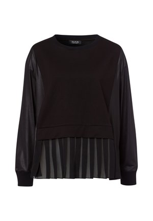 Black long-sleeve top with leather-textured sleeves and a pleated striped chiffon hem detail.