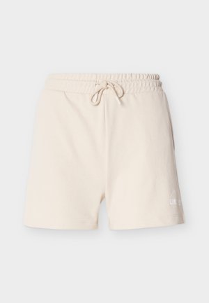 Bēša ikdienas īsās bikses ar elastīgu vidukļa jostu un aukliņu, ar mazu baltu drukātu tekstu pie kreisās kājas apakšmalas.