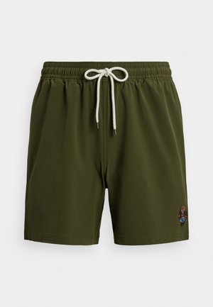 Maillots de bain vert olive avec une taille élastique et un cordon de serrage blanc. Présente un design détaillé brodé sur le côté inférieur.