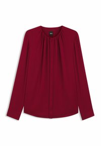 Blusa bordeaux a maniche lunghe con scollo rotondo, davanti plissettato e chiusura con bottoni. Realizzata in tessuto liscio con una silhouette rilassata.