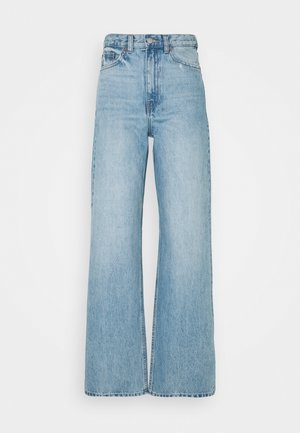 Light blue high-waisted wide-leg jeans in denim fabric. Features a classic button and zipper closure, with subtle faded texture and contrasting stitching.