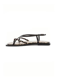 Black flat sandals with braided straps and a leopard print footbed. The design features a minimalist shape and a smooth finish.