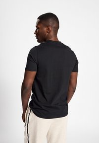 Hummel ICONS GRAPHIC - T-shirts print - black