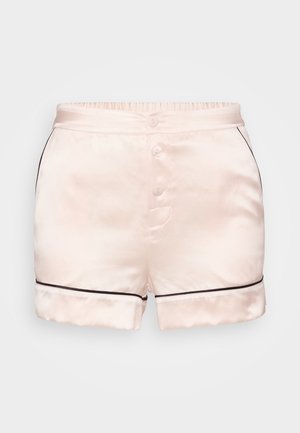 Satinshorts i lys rosa med en glatt tekstur, med en flat midjebånd, fem knapper og svart piping langs kanten.