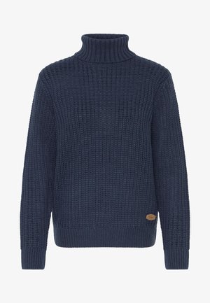 Tumesinine kudumiskotiga särk, millel on vahvlimuster, pikad varrukad, soonikkoes mansetid ja äär, ning väike pruun logo kleeplint äärtes.