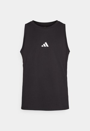 Svart ermeløs treningsskjorte laget av bomull. Har rund hals og en hvit Adidas-logo på brystet. Glatt tekstur.