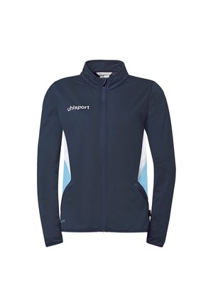 Veste de sport bleu marine à fermeture éclair avec des panneaux latéraux blancs et bleu clair, col montant, et logo "uhlsport" sur la poitrine.