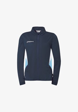 Veste de sport bleu marine à fermeture éclair avec des panneaux latéraux blancs et bleu clair, col montant, et logo "uhlsport" sur la poitrine.