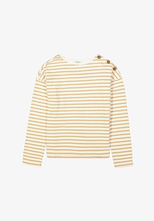 Langsleeve top in het wit met gouden horizontale strepen. Heeft schouderknopen en een ronde halslijn. Zacht, rekbaar materiaal.