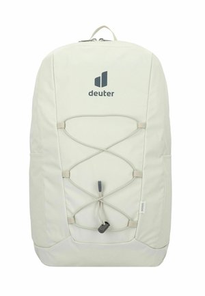 Sac à dos gris clair avec une finition mate, doté d'un logo, d'un cordon élastique à l'avant, et de poches latérales pour le rangement.