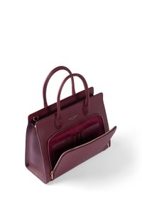 Burgundy leather handbag with two top handles, textured surface, a zippered front pocket, and interior compartments with a plush lining.