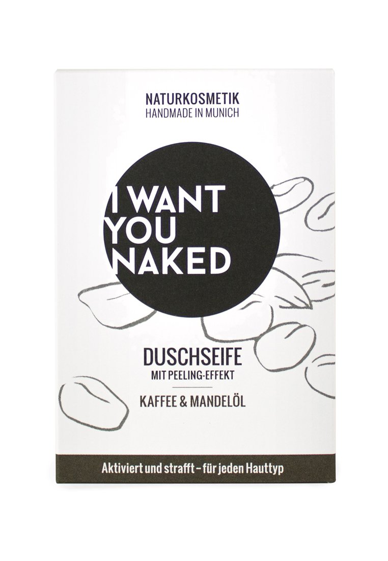 Witte doos met een cirkelvormige grafiek en zwarte tekst die zegt "IK WIL JOU NAKT." Het ontwerp bevat illustraties van koffiebonen. De tekst in het Duits beschrijft de voordelen van het product.
