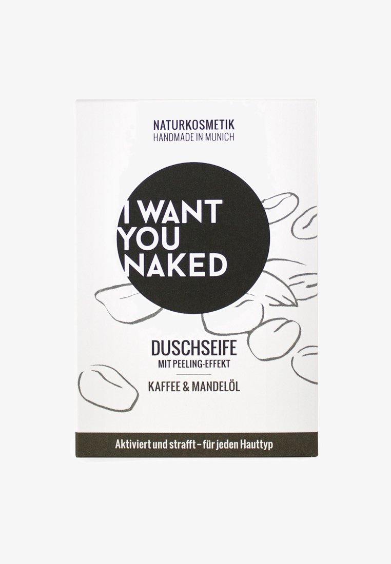 Witte doos met een cirkelvormige grafiek en zwarte tekst die zegt "IK WIL JOU NAKT." Het ontwerp bevat illustraties van koffiebonen. De tekst in het Duits beschrijft de voordelen van het product.