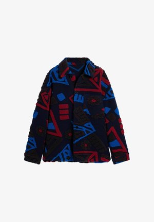 Faux fur jacket in dark navy with bold geometric patterns in red, blue, and brown. Features a collar, buttons, and a patch pocket.