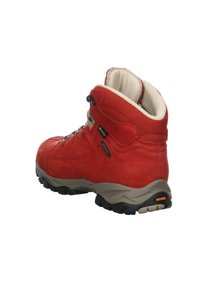 Rote, wasserdichte Wanderschuhe mit gepolstertem Kragen,metallenen Ösen und einer strukturierten Gummisohle. Mit beigen Akzenten und dezentem Branding.