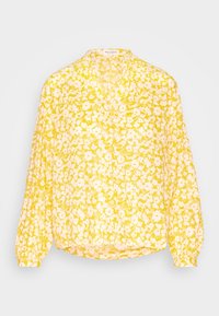 Blouse jaune à manches longues avec motif floral blanc, col en V avec boutons, coupe ample et poignets froncés.
