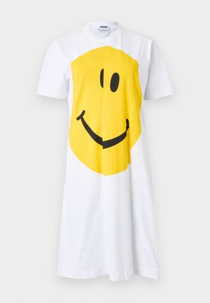 White short-sleeve dress with large yellow smiley face graphic centered on front, crew neck, and Moschino label inside collar.